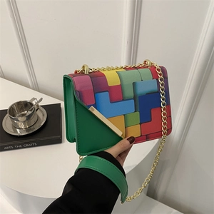 Stylish green leather crossbody bag with geometric print flap and gold chain strap