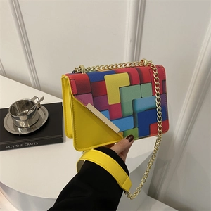 Chic chain shoulder bag with colorful geometric Tetris pattern and yellow side panels