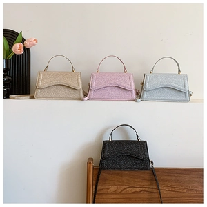 Detail of four sequined crossbody bags in gold pink silver and black with wave flaps