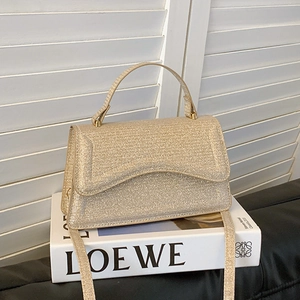 Champagne gold sequin crossbody mini bag with wave edge flap and top handle for parties