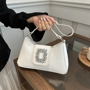 Elegant white faux leather underarm bag featuring a large rectangular rhinestone buckle detail