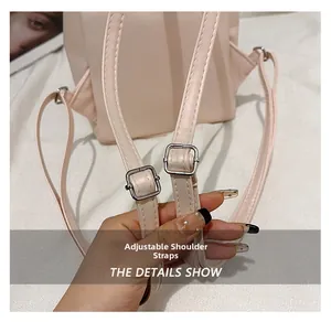 Close-up of adjustable shoulder straps with metal buckle on the cream leisure backpack