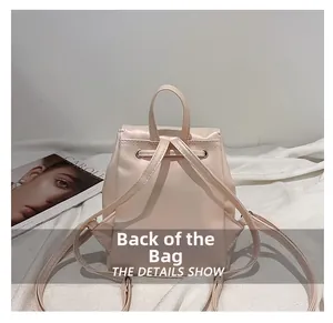 Back view of a minimalist pink PU leather backpack with drawstring closure and slim straps
