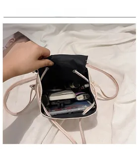 Top view of compact drawstring backpack showing interior capacity for gadgets and cosmetics