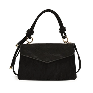 Elegant black pleated suede crossbody bag with knotted handle and golden metal ring