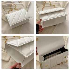 Detailed view of white quilted chain bag showing interior capacity and magnetic closure