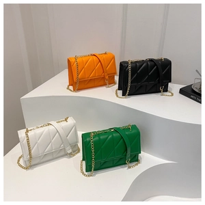 Quilted crossbody bags in four vibrant colors with elegant gold chain straps and sleek design