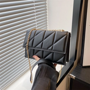 Quilted black chain shoulder bag with gold hardware and geometric triangle stitching