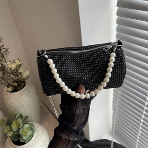 Elegant black rhinestone pillow bag with pearl handle and silver chain strap