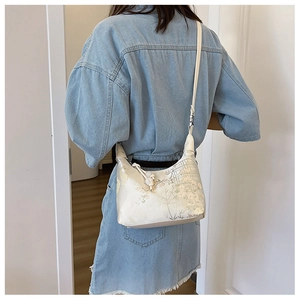 Detail of New Chinese style floral jacquard silk crossbody bag worn by a model