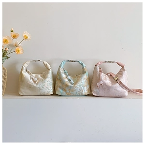 Detailed view of New Chinese style brocade bags with floral embroidery and metal handles