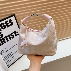 Pink New Chinese style underarm bag with forest embroidery and beaded drawstring details