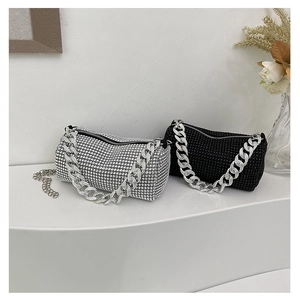 Detail of silver and black rhinestone mini bags with thick metal chain straps