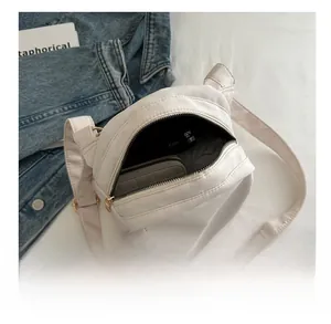 Internal view of the lightweight nylon shell bag showing storage capacity for essentials
