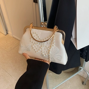 Elegant silk shell clutch bag with white pearl embroidery and golden metal handle