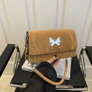 Brown textured underarm bag with silver butterfly buckle and metal chain strap