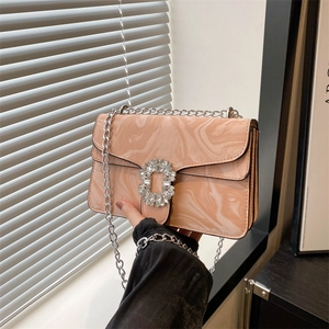 Pink marble pattern crossbody bag with silver chain strap and sparkling crystal buckle