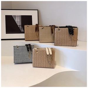 Collection of woven tote bags in neutral tones and houndstooth patterns with chain straps