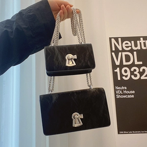 Black chain shoulder bag set with pleated texture and silver keyhole metal lock