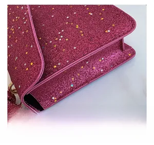 Detail of rose pink sequin bag showing stitching craft and star-shaped glitter texture