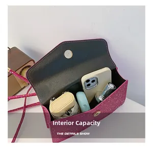 Internal capacity detail of fuchsia sequin crossbody bag showing phone and umbrella space