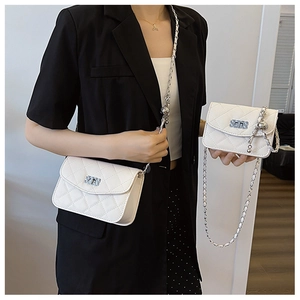 Quilted white crossbody bags with silver chain and decorative metal ball charms