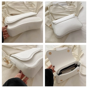 Close-up of white PU leather crossbody bag featuring wave-shaped flap and gold hardware