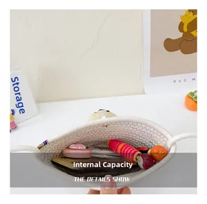 Internal capacity of the mini woven white crossbody bag showing storage for small items