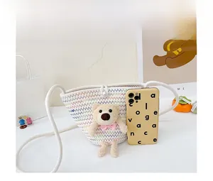 Mini woven crossbody bag for kids with cute plush bear and pearl buckle size comparison