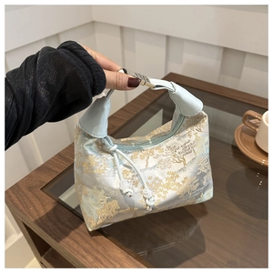 Detail of New Chinese style handbag with silk landscape jacquard pattern and leather handles