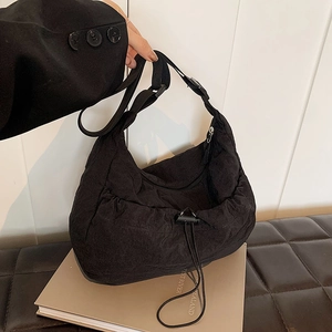 Large black pleated nylon hobo bag with drawstring and adjustable strap for daily use