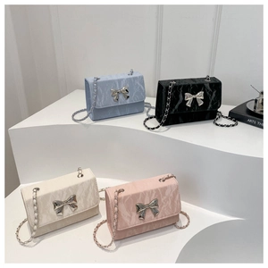 Detail of marble pattern mini bags with silver butterfly buckle and chain strap
