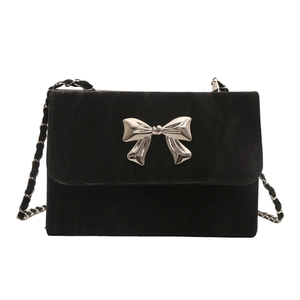 Elegant black velvet chain shoulder bag with silver metal bow and classic woven strap