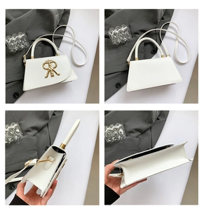 Detailed views of a white trapezoid crossbody bag with gold crown logo and strap
