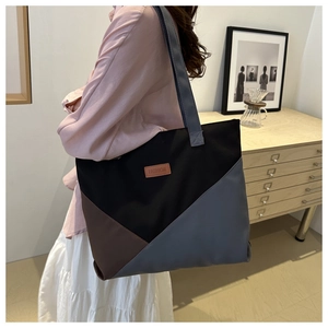 Fashion letter patch detail on a large color-block canvas tote bag for women