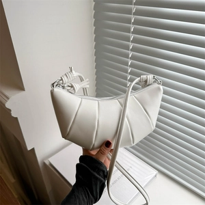 French minimalist white pleated croissant shoulder bag with knotted strap and silver zipper