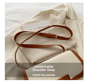 Detail of comfortable shoulder strap with retro buckle and premium canvas texture