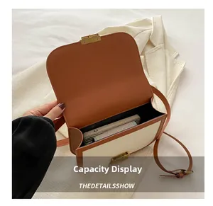 Capacity display of the vintage crossbody bag showing space for phone and wallet