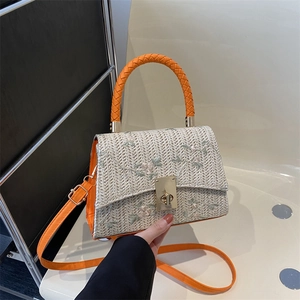 Sac bandoulière en paille avec broderies florales et lanières en cuir orange carré