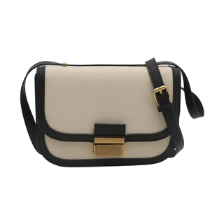 Minimalist cream and black contrast saddle bag with golden metal buckle and leather trim