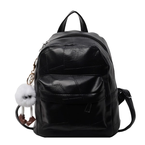 Silver stitched black leather mini backpack with cute white plush monster keychain