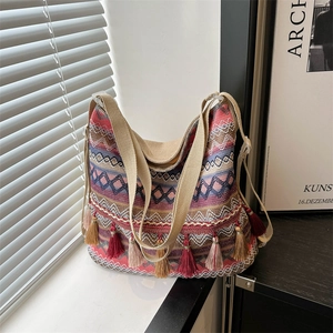 Ethnic bohemian tote bag with colorful geometric knitting and vibrant tassels decoration