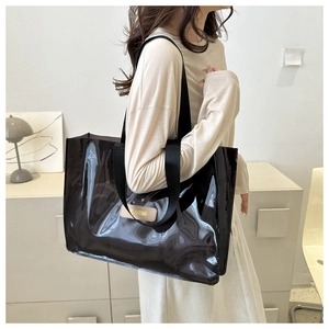 Detail of waterproof semi-transparent black PVC tote with durable canvas handles