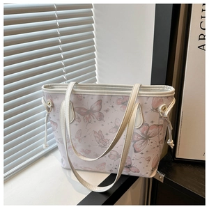 Détail du grand sac cabas blanc à imprimé papillon avec cordons de serrage latéraux