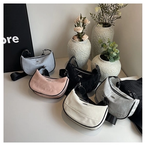 Detailed collection of crescent hobo bags in five colors with adjustable shoulder straps