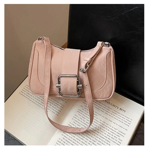 Detail of light pink baguette bag with marble texture and silver square metal buckle