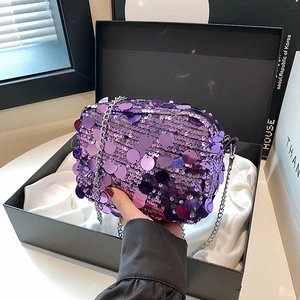Sparkly purple sequin crossbody bag with silver chain strap in an elegant gift box