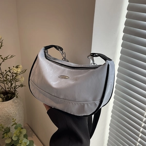 Sleek light gray shoulder bag with black trim and silver hardware for daily commute