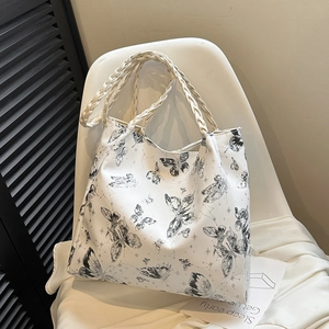 White butterfly print tote bag with woven handles for casual daily use and commuting