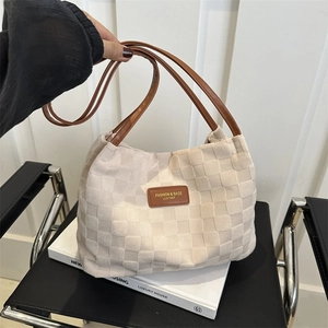 Minimalist beige checkered woven tote bag with brown leather handles for women